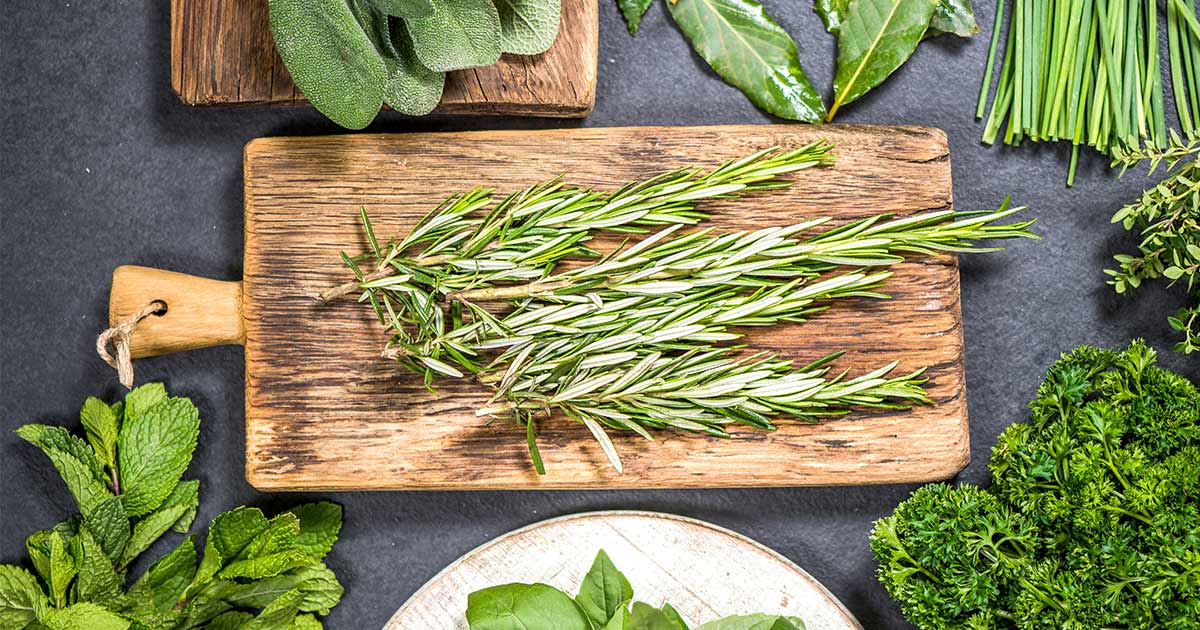 Herbs_Antiox_FB_Blog Antioxidant rich rosemary on a wodden cutting board
